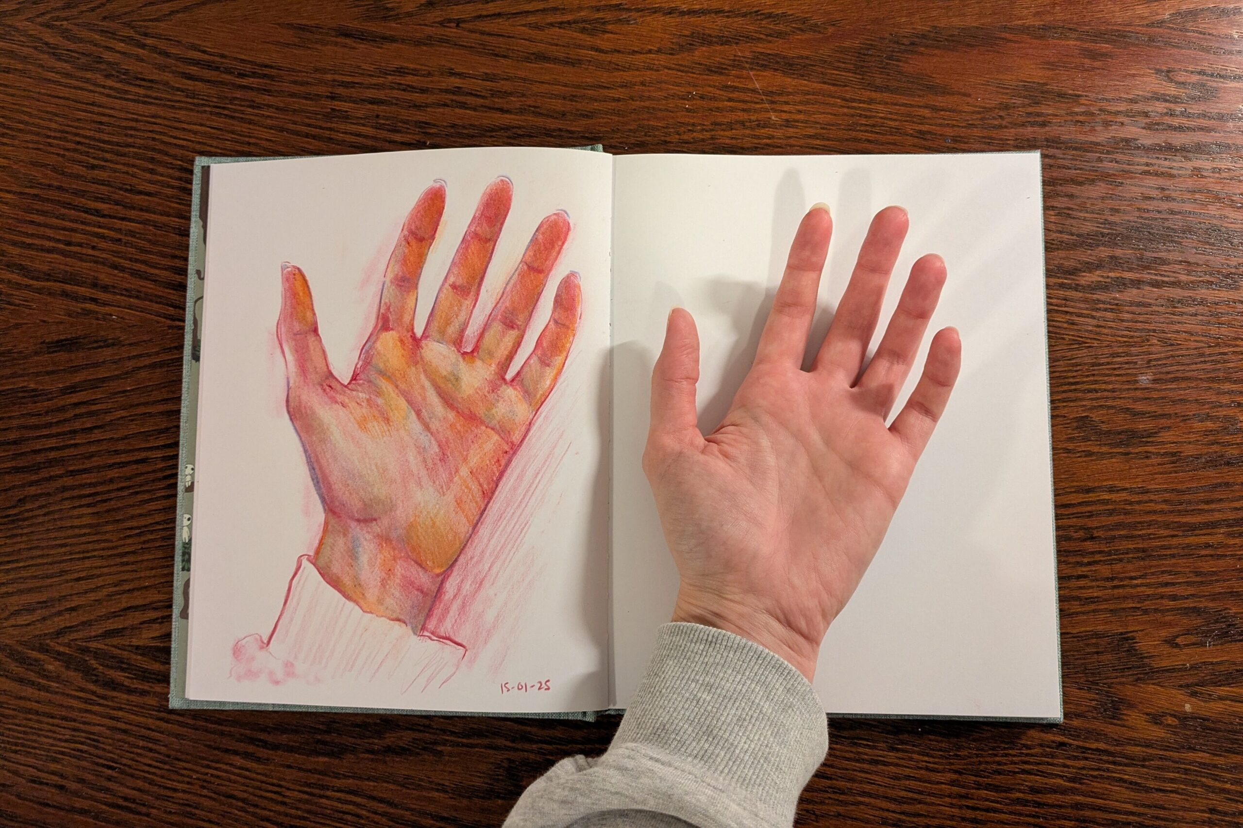 "My Hand" by Emi made colored pencils on sketchbook paper.